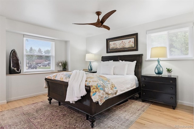 8612 W 69th Pl, Arvada, CO 80004 - bedroom featuring wood finished floors and a ceiling fan