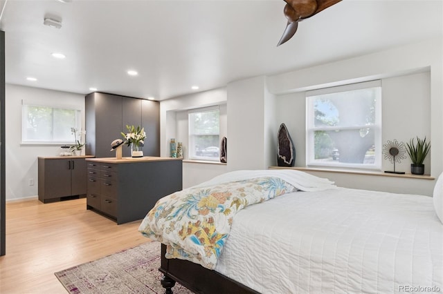8612 W 69th Pl, Arvada, CO 80004 - bedroom with light wood-style floors and recessed lighting