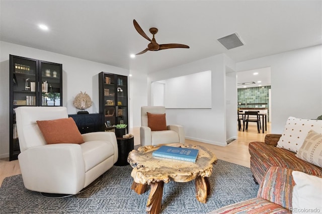 8612 W 69th Pl, Arvada, CO 80004 - living area featuring wood finished floors, recessed lighting, and a ceiling fan