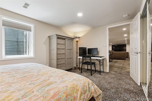 8612 W 69th Pl, Arvada, CO 80004 - bedroom with dark colored carpet, recessed lighting, and a desk