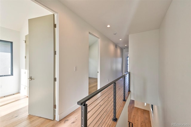 corridor featuring light hardwood / wood-style floors