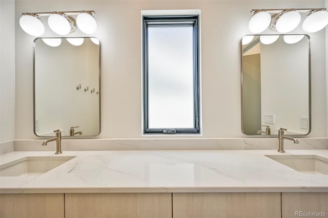 bathroom featuring vanity and a wealth of natural light