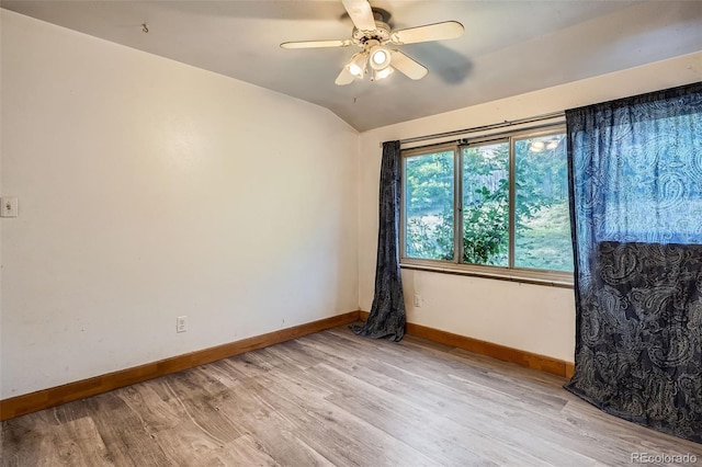 12576 W 7th Ave, Lakewood, CO 80401 - spare room featuring light wood-style flooring, ceiling fan, and vaulted ceiling