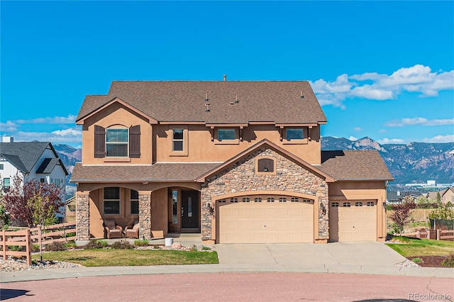 2459 Delicato Ct, Colorado Springs, CO 80921 - view of front of house with stucco siding, stone siding, concrete driveway, covered porch, and an attached garage