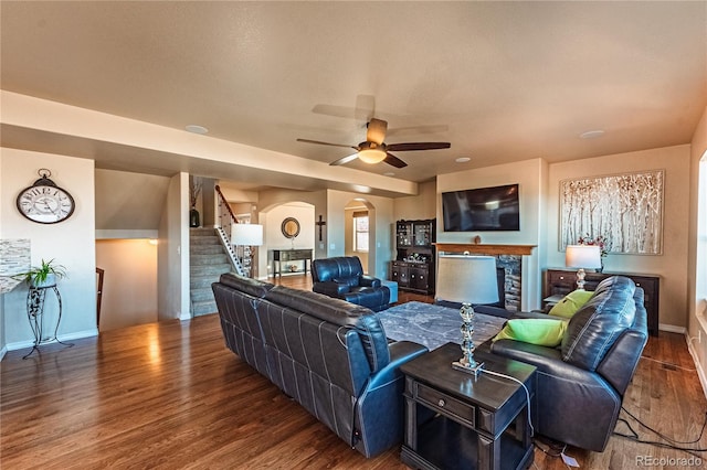 2459 Delicato Ct, Colorado Springs, CO 80921 - living room with wood finished floors, arched walkways, stairs, baseboards, and a ceiling fan