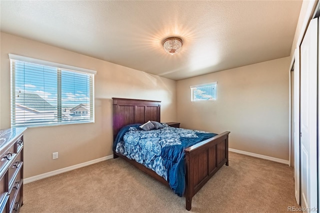 2459 Delicato Ct, Colorado Springs, CO 80921 - bedroom featuring light colored carpet and baseboards