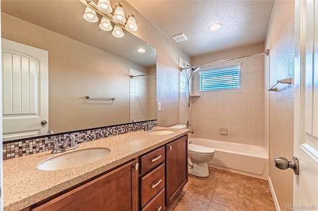2459 Delicato Ct, Colorado Springs, CO 80921 - full bath featuring bathing tub / shower combination, toilet, double vanity, a textured ceiling, and tile patterned floors