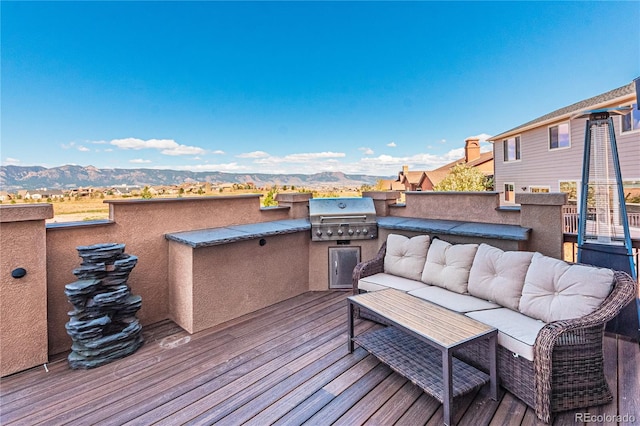 2459 Delicato Ct, Colorado Springs, CO 80921 - wooden terrace featuring an outdoor hangout area and a mountain view