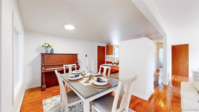 dining space featuring light hardwood / wood-style flooring