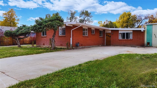 rear view of house with a lawn