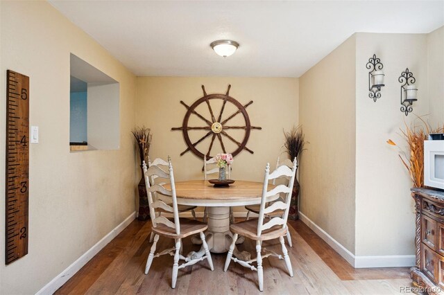 2865 Newland St, Wheat Ridge, CO 80214 - dining space with wood finished floors and baseboards