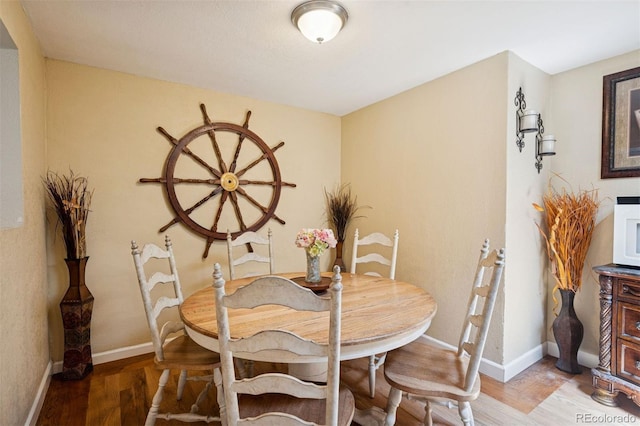 2865 Newland St, Wheat Ridge, CO 80214 - dining room featuring light wood-style floors and baseboards