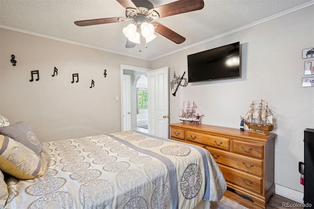 2865 Newland St, Wheat Ridge, CO 80214 - bedroom featuring a textured ceiling, ornamental molding, and a ceiling fan
