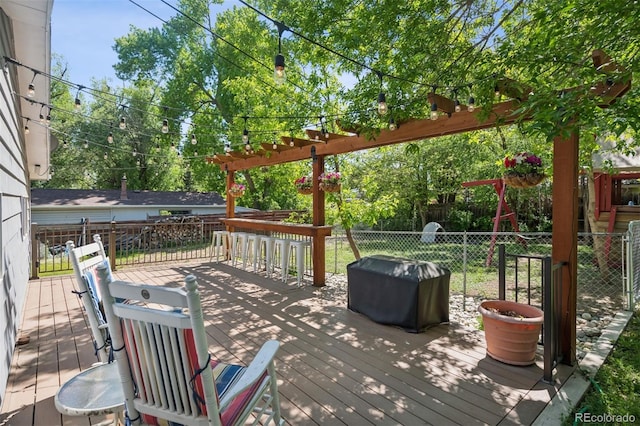 2865 Newland St, Wheat Ridge, CO 80214 - wooden deck featuring a fenced backyard, area for grilling, and a pergola