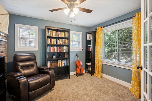 2865 Newland St, Wheat Ridge, CO 80214 - sitting room featuring carpet floors, plenty of natural light, a ceiling fan, and baseboards
