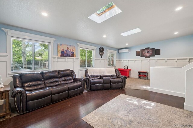 2865 Newland St, Wheat Ridge, CO 80214 - living area with a skylight, wood-type flooring, a wainscoted wall, healthy amount of natural light, and a wall unit AC