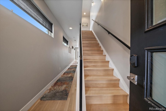 staircase featuring hardwood / wood-style floors