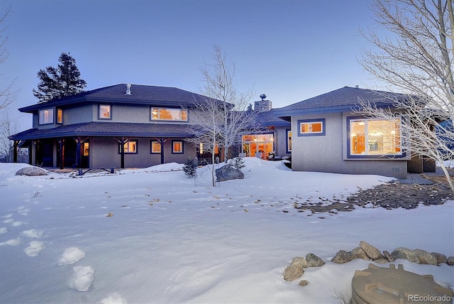 view of snow covered property