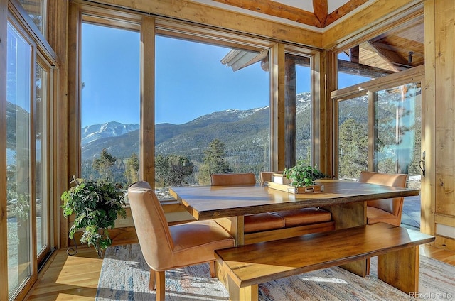 sunroom / solarium featuring a mountain view