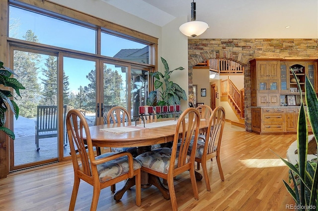 dining room with light hardwood / wood-style flooring and plenty of natural light