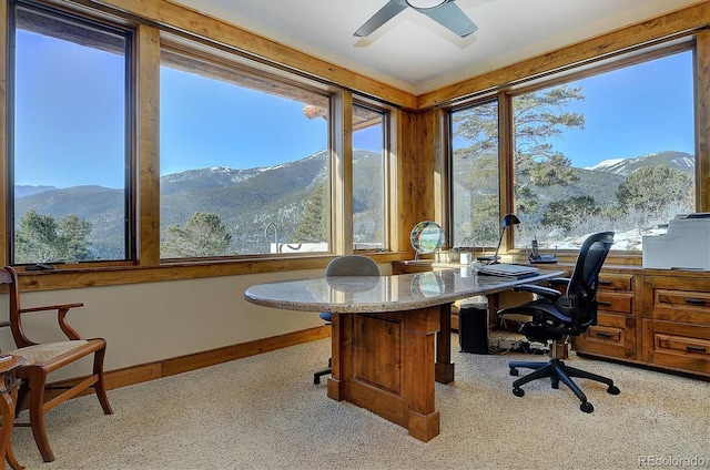 office with ceiling fan, a mountain view, and light carpet