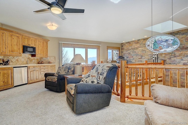 living room featuring sink and light carpet