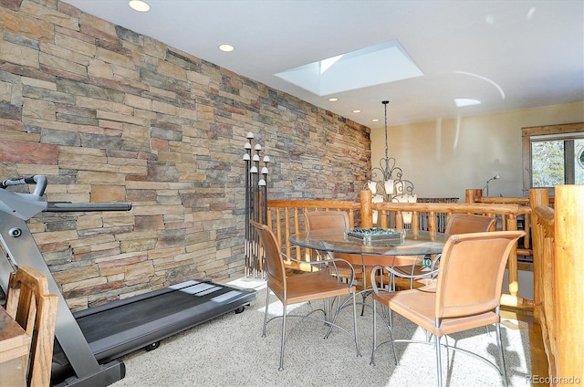 dining space with a skylight