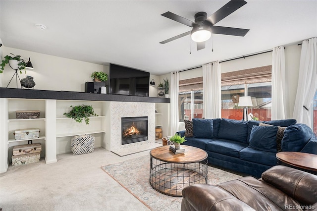 15776 E 107th Way, Commerce City, CO 80022 - living room featuring carpet flooring, a ceiling fan, a tile fireplace, and built in features