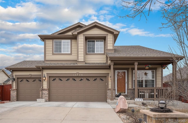 15776 E 107th Way, Commerce City, CO 80022 - view of front of property with covered porch, driveway, roof with shingles, an attached garage, and brick siding