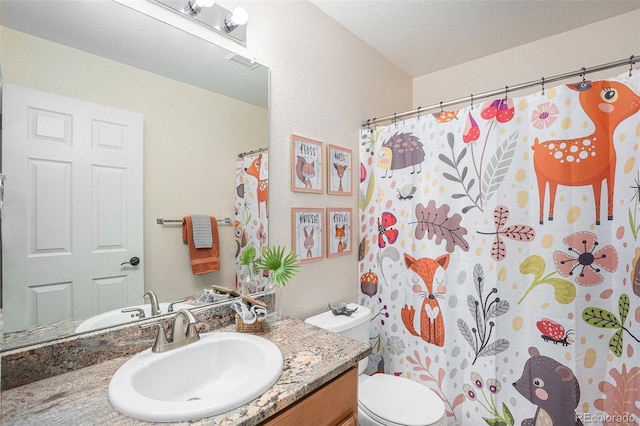 15776 E 107th Way, Commerce City, CO 80022 - bathroom with vanity, toilet, and a shower with curtain