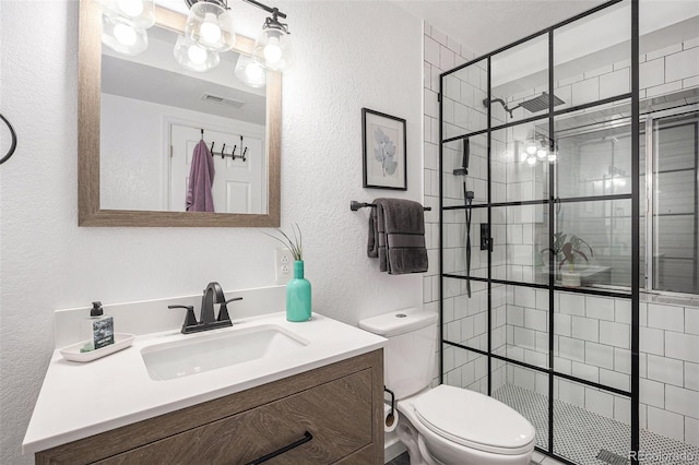 15776 E 107th Way, Commerce City, CO 80022 - full bath with a textured wall, toilet, vanity, and tiled shower