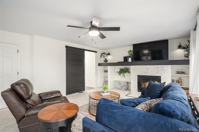 15776 E 107th Way, Commerce City, CO 80022 - living room with a ceiling fan, a fireplace, and light carpet