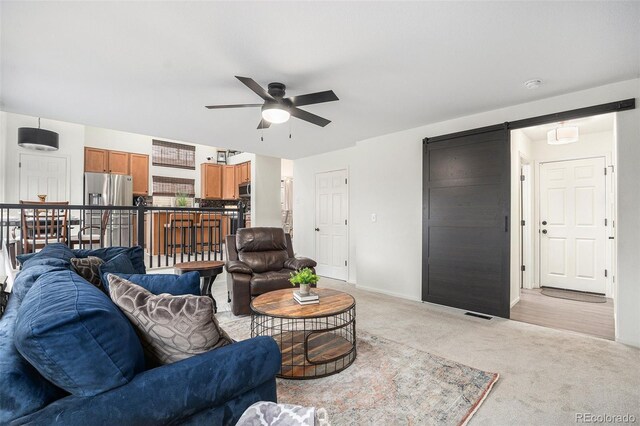 15776 E 107th Way, Commerce City, CO 80022 - living room with ceiling fan, light colored carpet, and baseboards