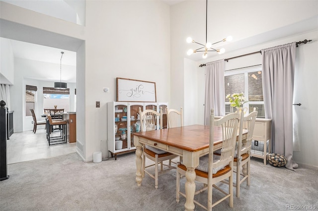15776 E 107th Way, Commerce City, CO 80022 - dining area with a chandelier, a towering ceiling, and carpet