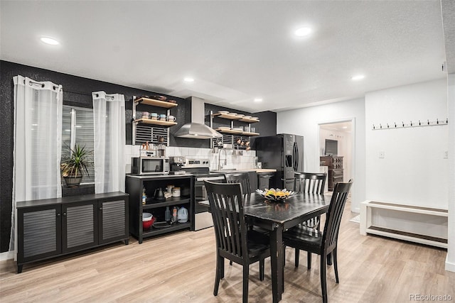 15776 E 107th Way, Commerce City, CO 80022 - dining room with light wood-type flooring, recessed lighting, and baseboards