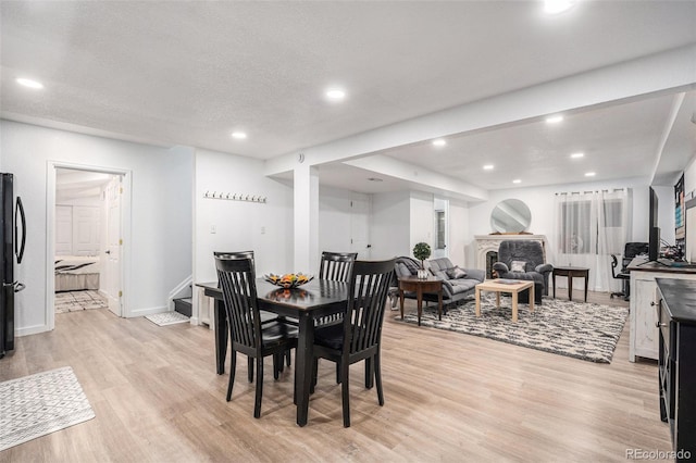 15776 E 107th Way, Commerce City, CO 80022 - dining space with light wood-type flooring, recessed lighting, stairway, and baseboards