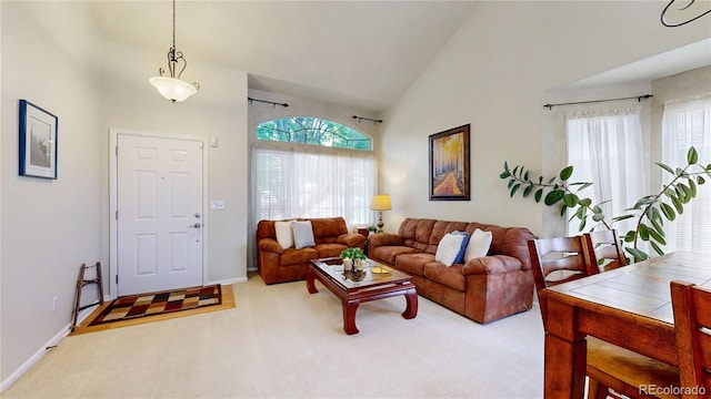 13307 Humboldt Dr, Thornton, CO 80241 - living room featuring high vaulted ceiling, carpet flooring, and baseboards