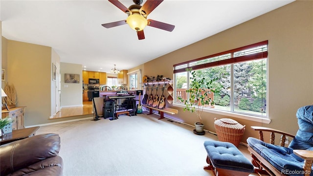 13307 Humboldt Dr, Thornton, CO 80241 - living area featuring a chandelier, ceiling fan, and baseboards