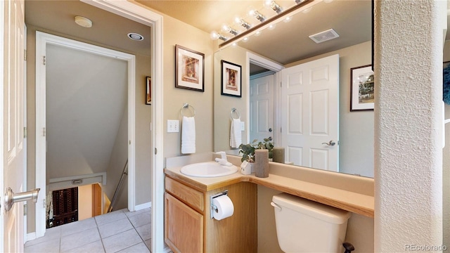 13307 Humboldt Dr, Thornton, CO 80241 - bathroom featuring tile patterned flooring, toilet, and vanity