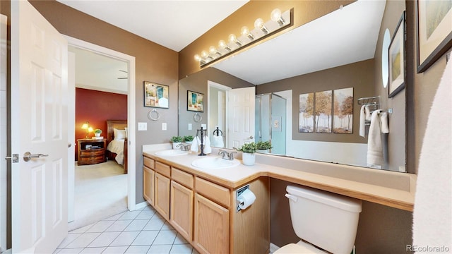 13307 Humboldt Dr, Thornton, CO 80241 - full bath with tile patterned floors, toilet, ensuite bath, and double vanity