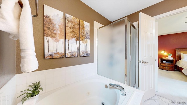 13307 Humboldt Dr, Thornton, CO 80241 - full bath with connected bathroom, a whirlpool tub, a stall shower, and tile patterned floors