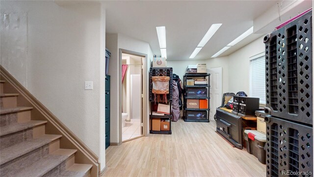13307 Humboldt Dr, Thornton, CO 80241 - below grade area with light wood finished floors and stairs