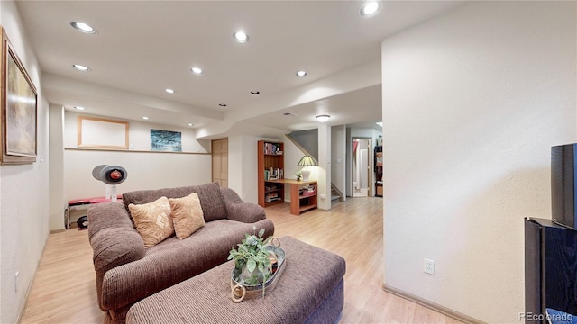 13307 Humboldt Dr, Thornton, CO 80241 - living room featuring light wood-style flooring, recessed lighting, and baseboards