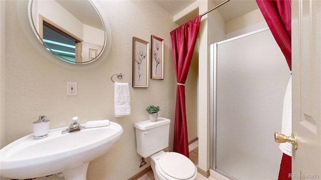13307 Humboldt Dr, Thornton, CO 80241 - bathroom with a stall shower, toilet, and a sink