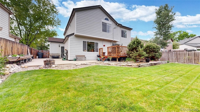 13307 Humboldt Dr, Thornton, CO 80241 - rear view of house with a deck and a patio