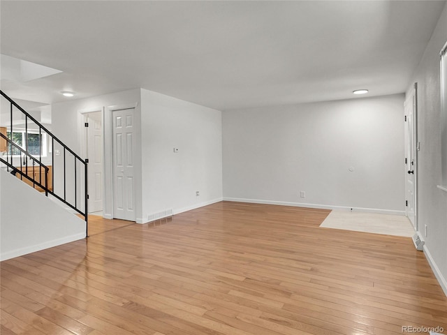 3061 W 92nd Ave Unit 14A, Westminster, CO 80031 - unfurnished room with light wood-style floors and stairway