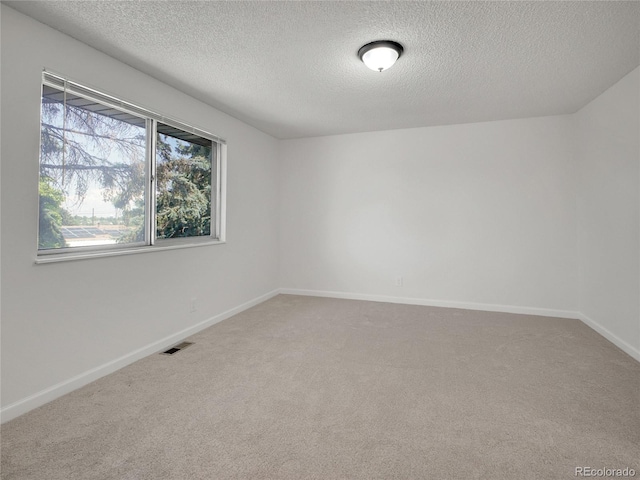 3061 W 92nd Ave Unit 14A, Westminster, CO 80031 - carpeted spare room with a textured ceiling and baseboards
