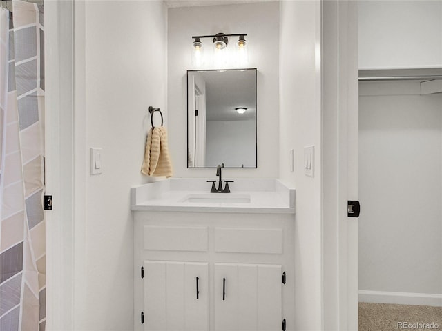 3061 W 92nd Ave Unit 14A, Westminster, CO 80031 - bathroom with vanity and baseboards