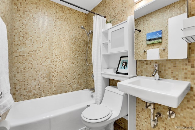 full bathroom with toilet, sink, shower / bath combo with shower curtain, and backsplash