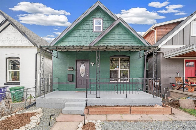 view of front of property featuring a porch and brick siding